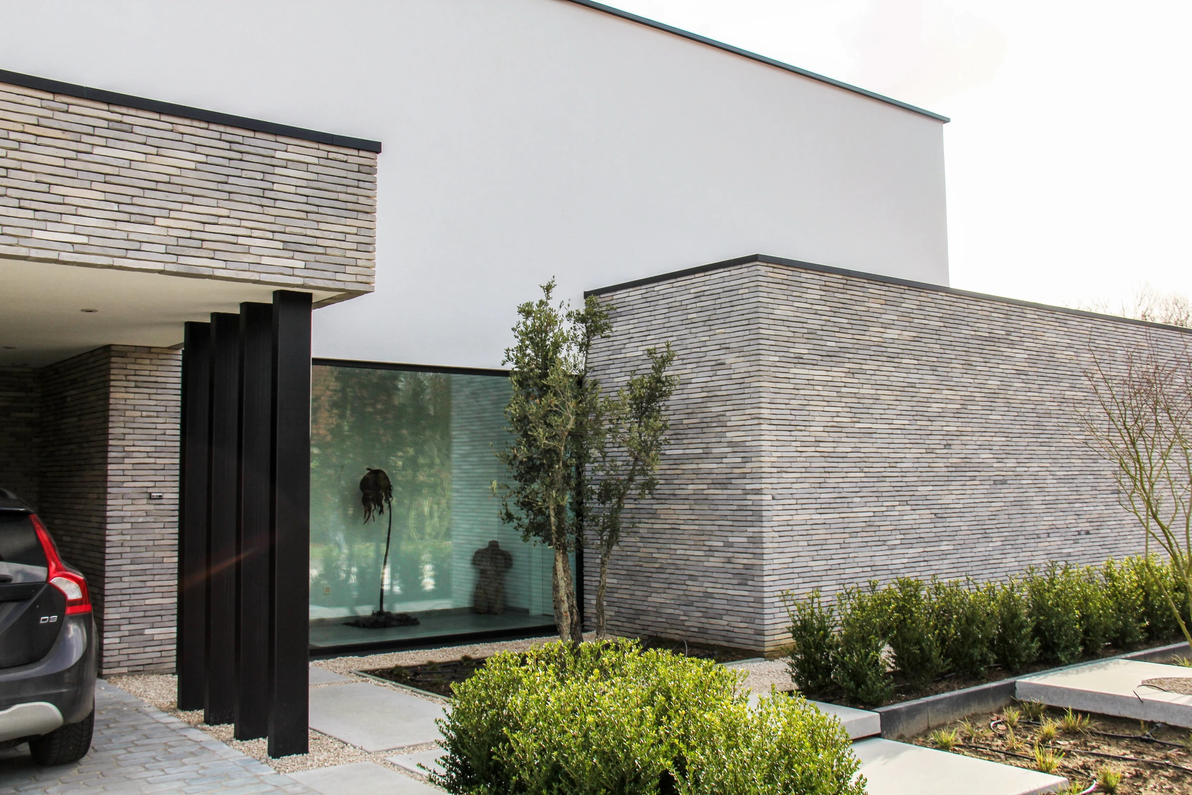 moderne villa, hedendaagse architectuur, strakke villa, luxe woning, moderne nieuwbouw, minimalistische architectuur, exclusieve villa, architectuur op maat, energiezuinige woning, moderne woning met grote raampartijen, hedendaagse gezinswoning.